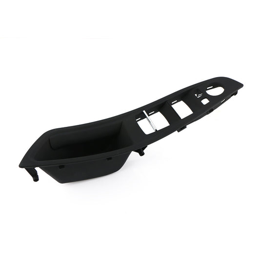 Black trim around the front right door window control panel for BMW F10